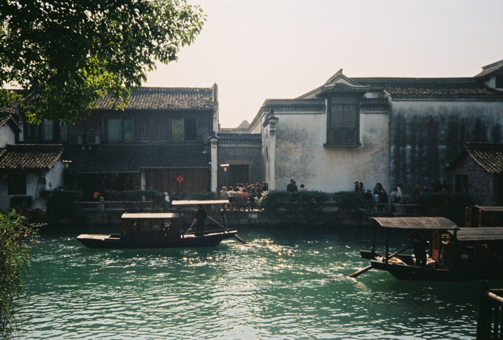 View from the water of two houses somewhere in China
