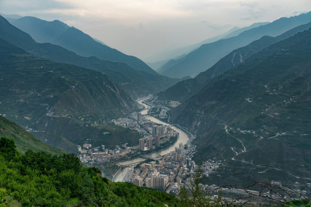 Aerial view of the river between two mountains and a small village