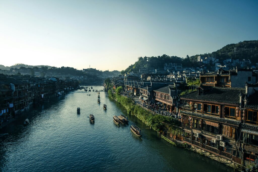 A long river and historic wooden houses along the banks