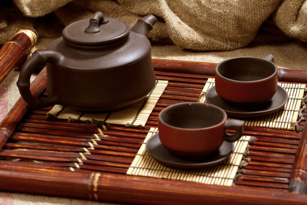 A traditional Chinese tea set arranged on a bamboo tray