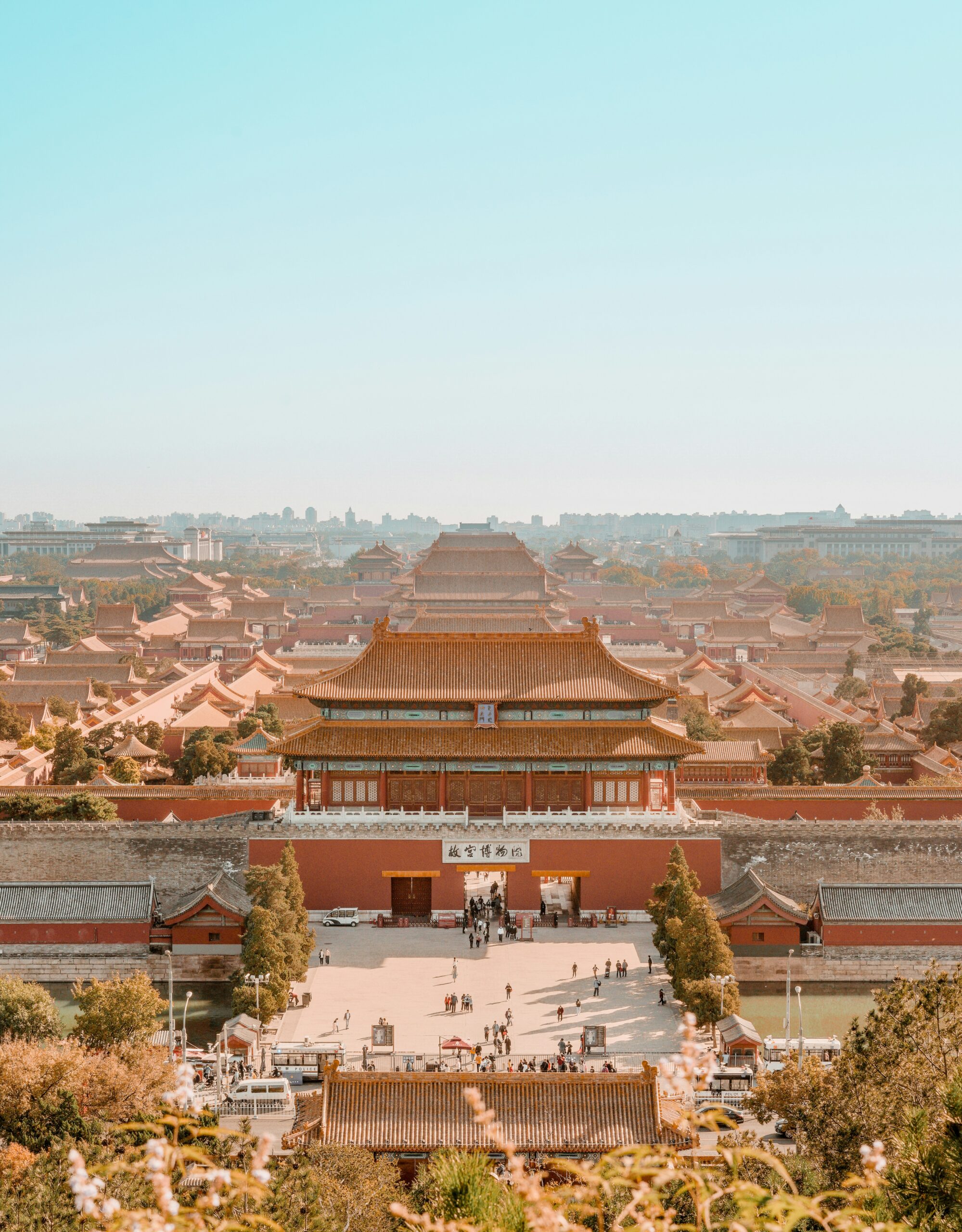 view of the Forbidden City in Beijing, China, with its traditional Chinese architecture, golden rooftops